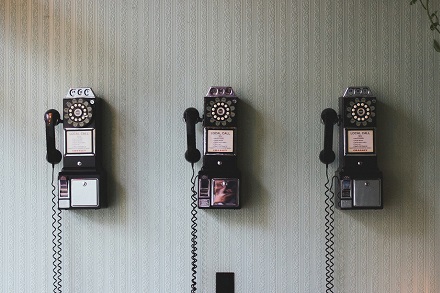 three old telephones